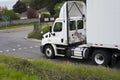 Big rig day cab semi truck with roof spoiler transporting dry va Royalty Free Stock Photo