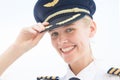 Commercial captain pilot in uniform smiling. Aviation
