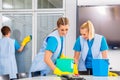 Cleaning brigade working in office