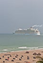 Commercial cruise ship leaving port and a Ft. Lauderdale beach on a stormy, misty afternoon