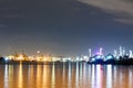 Commercial docks with light at night with a ship and crane Royalty Free Stock Photo