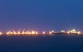 Commercial docks at sunset with ship and cranes Royalty Free Stock Photo