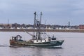 Commercial fishing boat Boomer Too passing New Bedford residential area