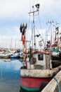 Commercial Fishing Boat in Harbor with Nets and Flags