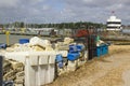 Commercial fishing nets and plastic boxes discarded on the quayside at Warsash on the south coast pf England in Hampshire