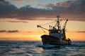 commercial fishing vessel with dramatic dawn sky on the horizon Royalty Free Stock Photo