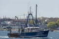 Commercial fishing vessel Endeavor with factory in background