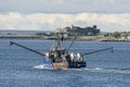 Commercial fishing vessel Miss Madeline with Fort Taber in background