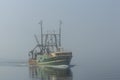 Commercial fishing vessel Vila Nova do Corvo I in fog Royalty Free Stock Photo