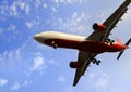 Commercial flight airplane flying on blue sky in travel tourism concept Royalty Free Stock Photo