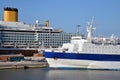 Commercial harbor, modern cruise ship and old ferry Royalty Free Stock Photo