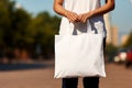 Woman hands holding white blank with copy space bag Royalty Free Stock Photo