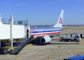 Commercial jet aircraft on tarmac loading its cargo at airport before flight Royalty Free Stock Photo