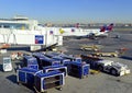 Commercial jet aircraft on tarmac loading its cargo at airport before flight Royalty Free Stock Photo