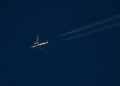 Commercial Jet with Contrails at Sunset