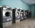 Commercial laundry with six washing and drying machines Royalty Free Stock Photo