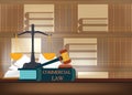 Commercial law books on a table and blurred bookshelves Royalty Free Stock Photo