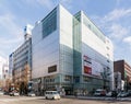 Commercial modern building with cars moving on the road in Sapporo in Hokkaido, Japan