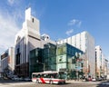 Commercial modern building with moving bus on the road in Sapporo in Hokkaido, Japan