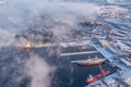 Commercial north arctic port is loading containers onto cargo tanker ship. Concept logistics and delivery of goods Royalty Free Stock Photo