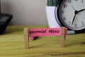 Commercial Offers. Handwriting on sticky notes in clothes pegs on wooden office desk