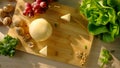 Commercial pack shot with cheese, grapes, walnut and greens on serving board