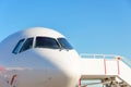 Commercial passenger aircraft, ready for boarding on the landing strip of an airport Royalty Free Stock Photo