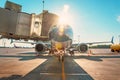 Commercial passenger airplane in the parking at the airport terminal with a nose forward and a gangway. Service and preparation Royalty Free Stock Photo