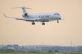 Commercial passenger jet airliner Bombardier CRJ900 of the Adria Airways Airline. Airplane is fliyng towards the runway ready for 