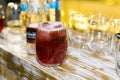 Commercial picture of a glass with cider on a bar