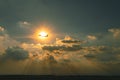commercial plane flying over sky against beautiful sun ray through cloudscape Royalty Free Stock Photo