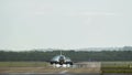 Commercial plane landing at the airport with strong crosswind Royalty Free Stock Photo