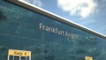 Commercial plane take off reflecting in the windows with Frankfurt Airport text, 3d rendering