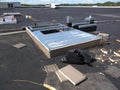 Commercial roofing repairs in progress on EPDM roof; AC curb wrapping