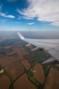 06/09/2021. Commercial Ryanair airborne airplane at high altitude. Cabin window view at wing with company name.