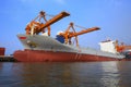 Commercial ship floating in ship yard loading container use for Royalty Free Stock Photo