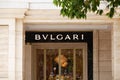 Commercial sign with black and white Bvlgari logo above a fashion store entrance Royalty Free Stock Photo