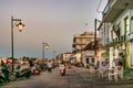 The commercial street Spetson-Moni Agion Anargiron and their old taverns and stores at evening, Spetses, Greece. Royalty Free Stock Photo