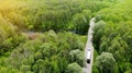 Commercial truck driving along the rural road between forest Royalty Free Stock Photo