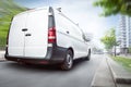 Commercial van driving in the city Royalty Free Stock Photo