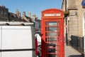 Commercial van seen parked close to a British red phone booth. Royalty Free Stock Photo