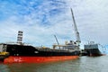 Commercial vessel and RO-RO ship berth to quay area of dock fo Royalty Free Stock Photo