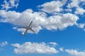 Low angel view of a commercial jet airplane in flight Royalty Free Stock Photo