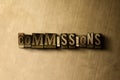 COMMISSIONS - close-up of grungy vintage typeset word on metal backdrop Royalty Free Stock Photo