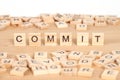 Commit,word written on wood cube