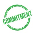 COMMITMENT text written on green grungy round stamp