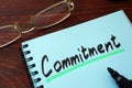 Commitment written on a notepad. Royalty Free Stock Photo