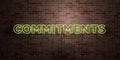 COMMITMENTS - fluorescent Neon tube Sign on brickwork - Front view - 3D rendered royalty free stock picture