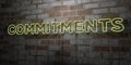 COMMITMENTS - Glowing Neon Sign on stonework wall - 3D rendered royalty free stock illustration