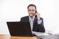 Committed employee smiling at phone